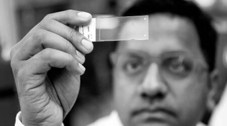 Glaucoma Annual Report cover image: man looking at test sample