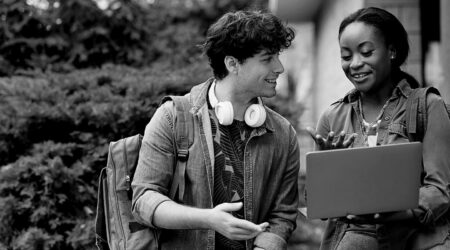 College Students talking over a computer