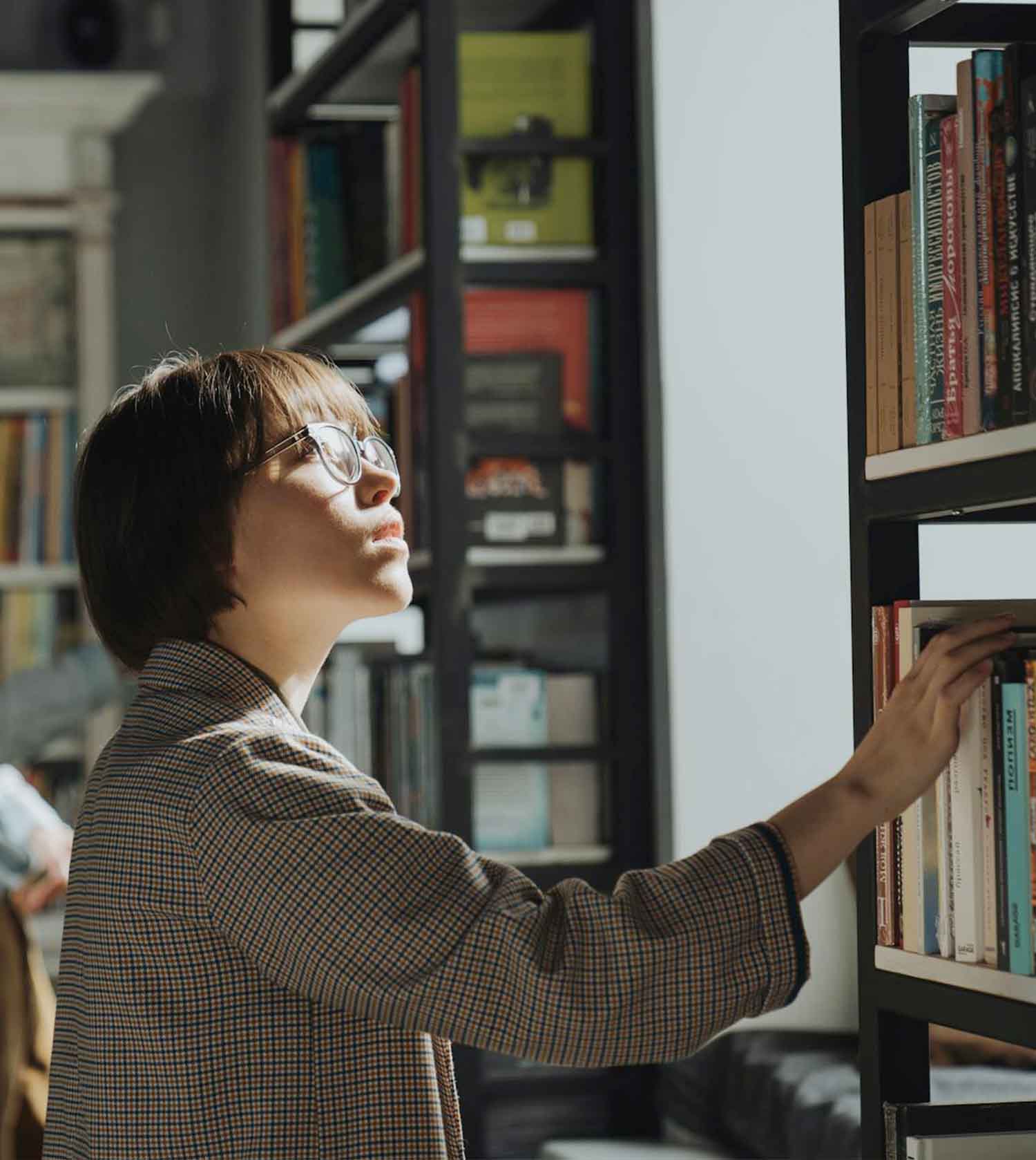 Woman browsing books in bookstore