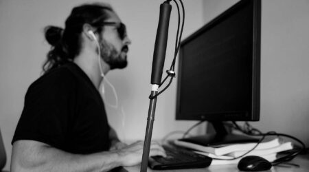 Visually impaired man at a computer